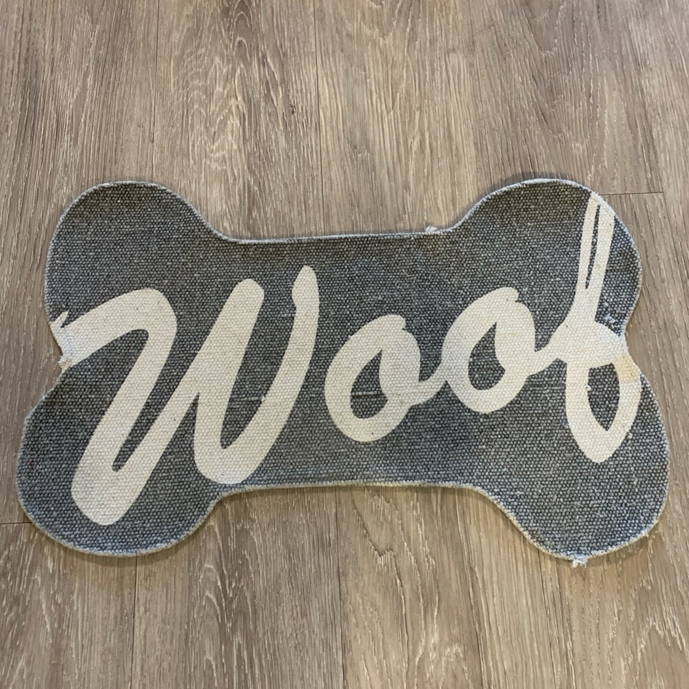 “Woof” dog bowl mat